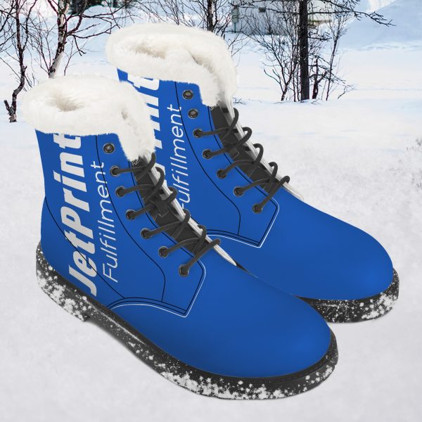 A pair of blue women's mid-boots with the "JetPrnt" logo in the snow