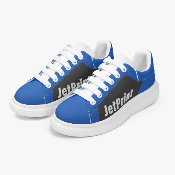 a pair of blue and black oversized sneakers with logo