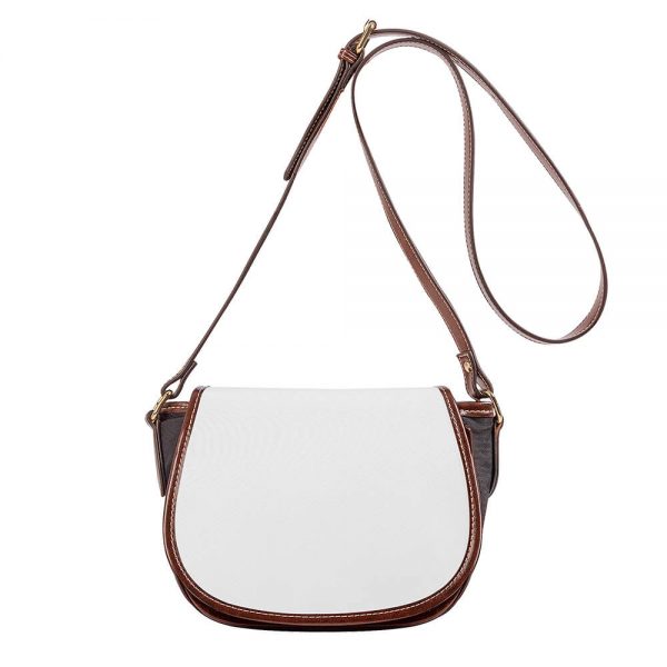 A white crossbody saddle bag's rope is suspended in mid-air.