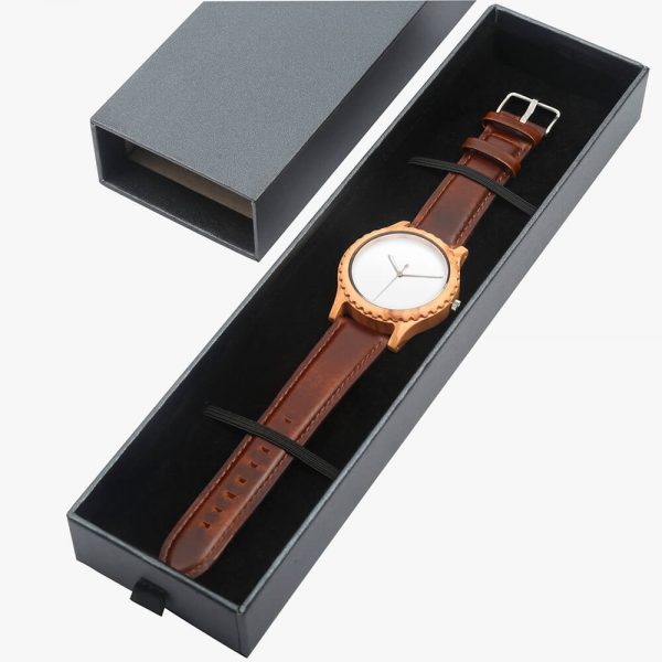 A brown watch is placed in a gift box