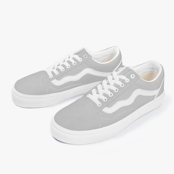 A pair of grey low-top canvas sneakers