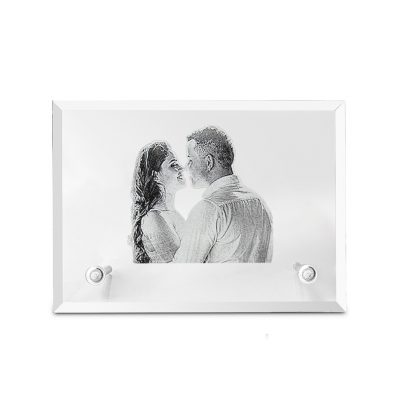 A photo of a couple is customised in a crystal photo frame