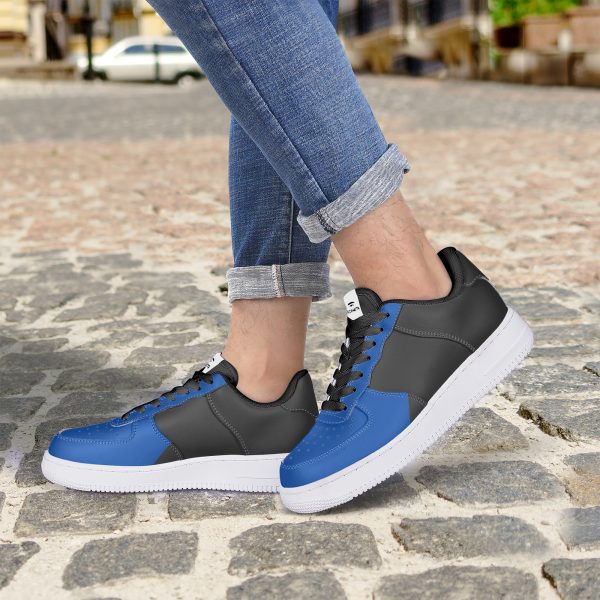 A female model wearing a pair of blue and black sneakers