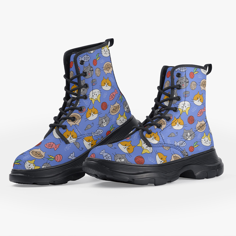 A pair of blue boots with cartoon patterns