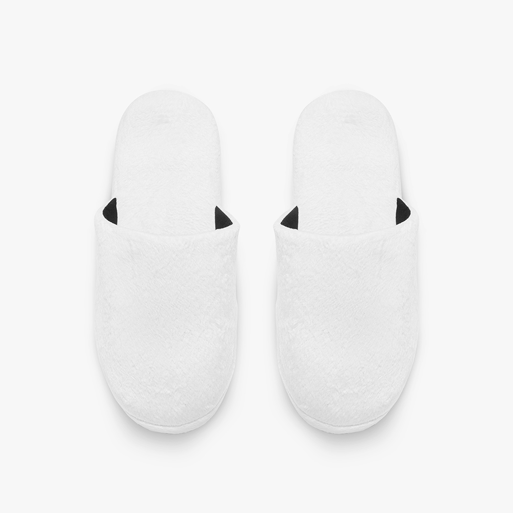 A pair of plain white classic cotton slippers