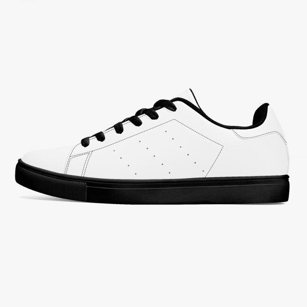 a pair of white and black bottom low-top breathable leather sneakers