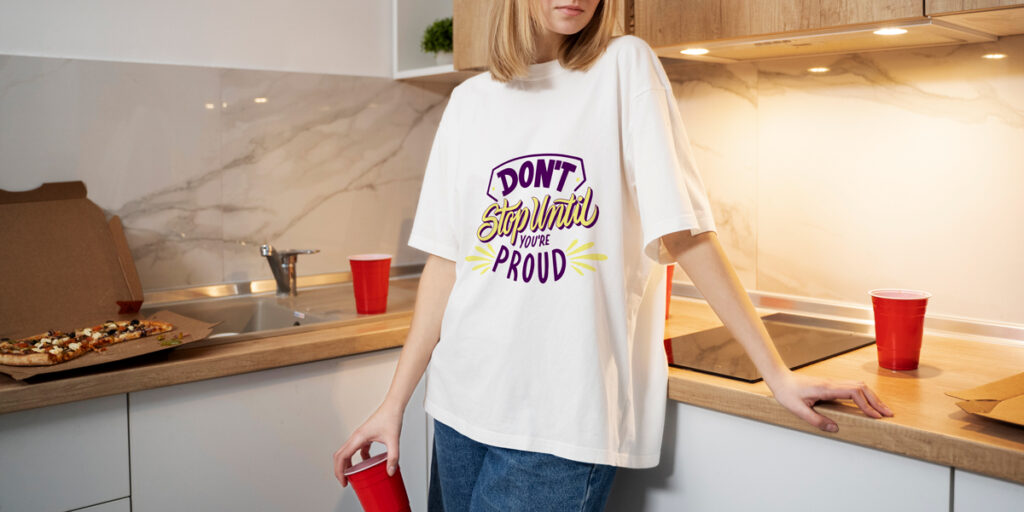 A woman wearing a white T-shirt with a cool saying