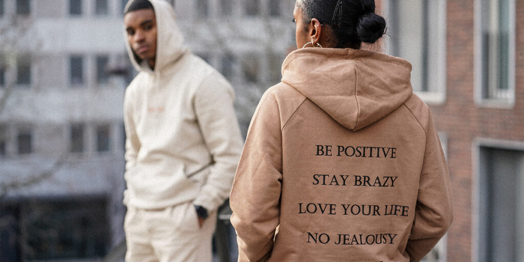 Boys and girls wearing hoodies with motivational quotes