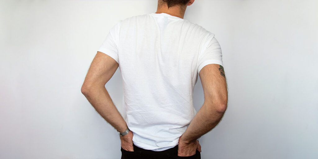 A man wearing a white T-shirt